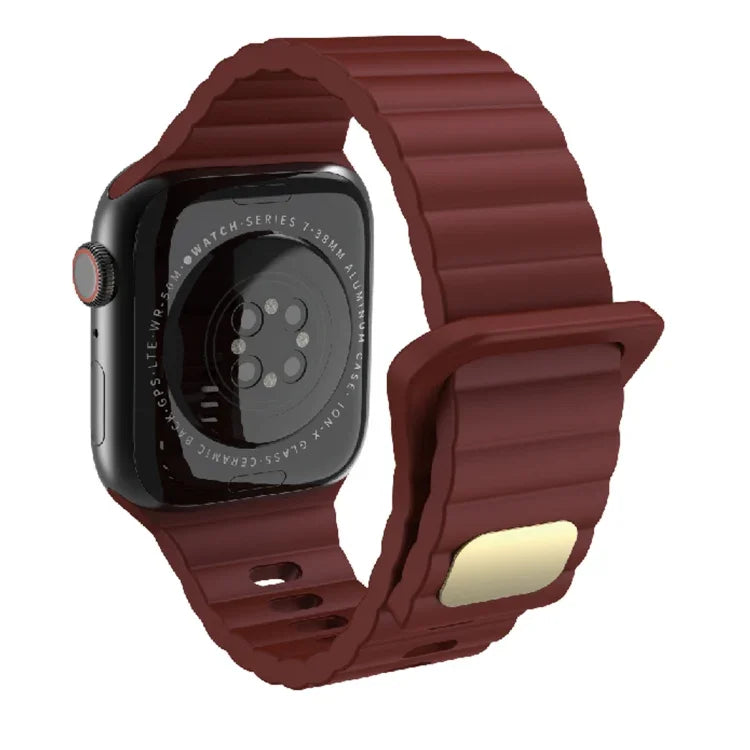 Breathable silicone watch strap for Apple Watch in maroon color on a black watch.