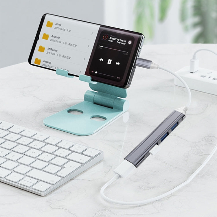 محطة إرساء صغيرة متعددة الوظائف 4 في 1، المواصفات: Type-C/USB-C 3.0 (فضي)، Type-C/USB-C 3.0 (فضي)، Type-C/USB-C 3.0 (رمادي)، Type-C/USB-C 3.0 (وردي)، USB 3.0 (فضي)، USB 3.0 (رمادي)، USB 3.0 (وردي)